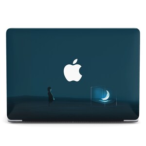May include: A dark blue laptop with a white Apple logo and a crescent moon graphic on the screen. The laptop is on a white background.