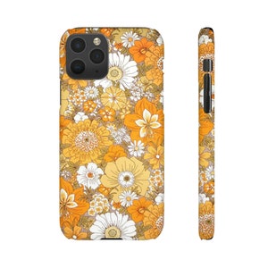 May include: A phone case with a floral pattern in shades of orange, yellow, and white. The case has a black camera cutout and a black border.
