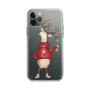 May include: Clear phone case featuring a watercolor illustration of a deer wearing a red sweater and holding a gold bell. The deer has antlers decorated with ornaments. The case is designed for a smartphone.
