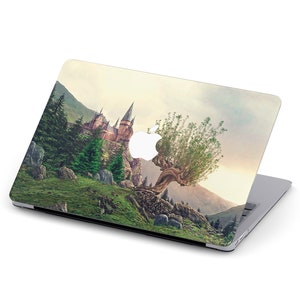 May include: A laptop skin with a whimsical design featuring a castle nestled in a mountain landscape with a large willow tree growing out of the cliffside. The tree's branches reach towards the castle, creating a magical and enchanting scene.