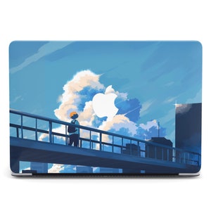 May include: A blue and white laptop skin with a stylized illustration of a person walking on a bridge against a blue sky with white clouds. The Apple logo is visible on the laptop.