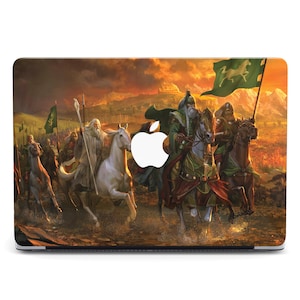 May include: A laptop skin featuring a dramatic battle scene with riders on horseback, flags, and a fiery sunset backdrop. The design includes figures in green and brown attire, with a white horse and a green flag with a white horse emblem. The Apple logo is visible.