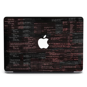 May include: A black laptop with a white Apple logo on the lid. The laptop is covered in a design of pink and black code.