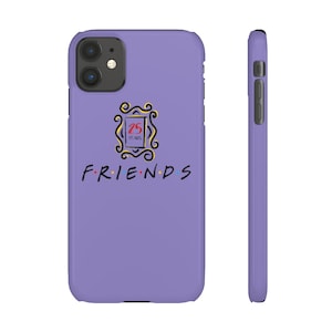 May include: Purple iPhone case with a white outline of the iconic "Friends" logo and the text "FRIENDS" with colorful dots. The logo also includes the text "25 YEARS".