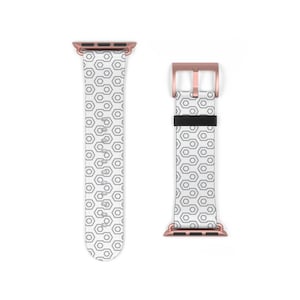 May include: A white Apple Watch band with a geometric pattern and rose gold hardware. The band is shown in both the closed and open positions.