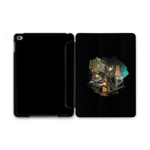 May include: A black iPad case with a colorful illustration of a person standing in a city street at night. The illustration is surrounded by a black circle.