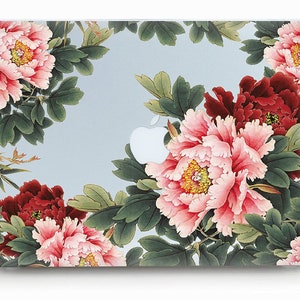 May include: A laptop skin with a floral design featuring pink and red peonies with green leaves on a light blue background.