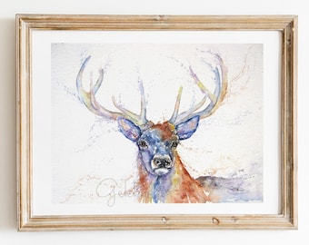 May include: Watercolour painting of a deer with large antlers. The deer is painted in shades of blue, purple, and brown. The background is a light wash of watercolour with splashes of colour.
