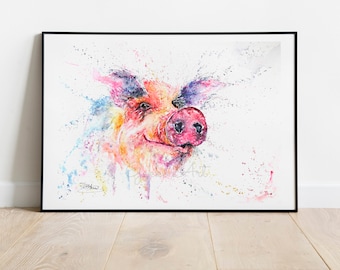 May include: A watercolour painting of a pig's face, framed in black. The pig is depicted with a happy expression, using a vibrant palette of pink, orange, blue, and yellow. Paint splatters surround the pig's head, adding to the artwork's charm.