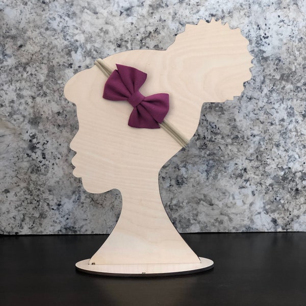 Hair bow stand and displays. Head stand, high bun silhouette. Show case hair bows.