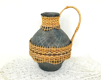 Vintage decorative ceramic jug Black earthenware jug with straw handle Pottery in the interior Ceramic pitcher Stoneware pitcher Clay pot