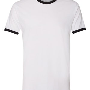 May include: White t-shirt with a black ringer neck and black trim on the sleeves.