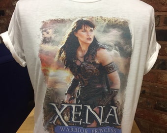 Xena Warrior Princess - White T-Shirt. Men's and Women's Sizes. Lucy Lawless