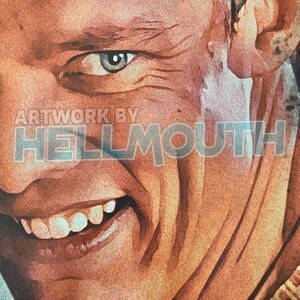May include: Close-up of a man's face with a wide smile, showing his teeth. The man has a weathered, tanned complexion and a few wrinkles around his eyes. The background is blurred and out of focus. Artwork by HELLMOUTH.
