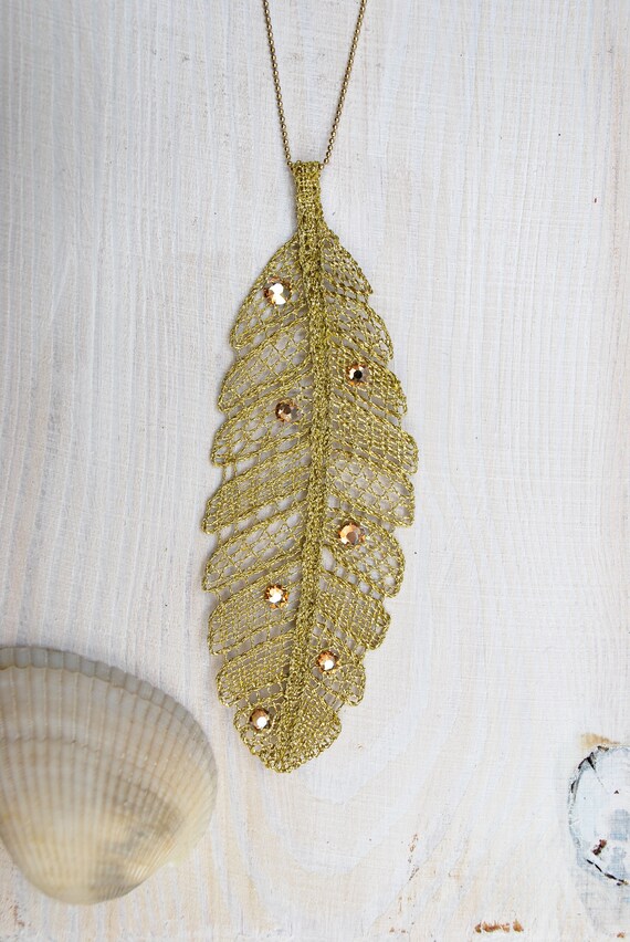 Swarovski Krishna Peacock Feather Designer Pendant for Women by Yellow  Chimes : YELLOW CHIMES: Amazon.in: Jewellery