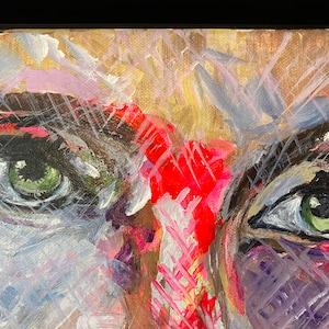 May include: Abstract painting of a face with two green eyes, red, pink, white, and black paint strokes. The background is a light brown color.