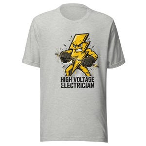 May include: A light gray short-sleeve t-shirt featuring a graphic of an angry yellow lightning bolt character wearing black gloves and holding an electrical wire. Below the character, the text reads HIGH VOLTAGE ELECTRICIAN.