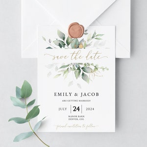 May include: Save the date card with a watercolor floral design in shades of green and gold. The text reads "Save the date" in gold script. The card also includes the names Emily & Jacob, the date July 24, 2024, and the location Manor Barn, Denver, CO.