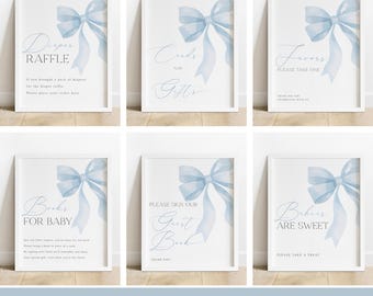May include: Six printable baby shower signs with a blue watercolor bow design. The signs include "Diaper Raffle", "Cards and Gifts", "Favors Please Take One", "Books for Baby", "Please Sign Our Guest Book", and "Babies Are Sweet Please Take a Treat".