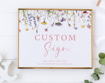May include: A white sign with a gold frame and a floral border. The sign says "CUSTOM Sign" and "ADD YOUR OWN TEXT 8x10 PORTRAIT & LANDSCAPE".