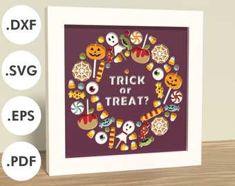 May include: A white frame with a purple background featuring a circle of Halloween themed candy and the text "Trick or Treat?"