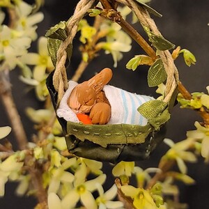 Baby Bunny Sleeping in a Leaf Basket Figurine/Ornament - Brown