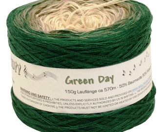 May include: A skein of green, beige, and cream yarn with a label that reads "Green Day 150g Lauflänge ca 570m - 50% Baumwolle 50% Polyester".