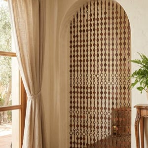 May include: A hanging room divider curtain composed of multiple vertical strands of dark brown wooden beads. The beads alternate between circular rings and elongated diamond shapes, creating a repetitive geometric pattern across the arched doorway.
