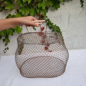 Wire basket with handles. Foldable metal wire bag. Mesh container for storage and transportation