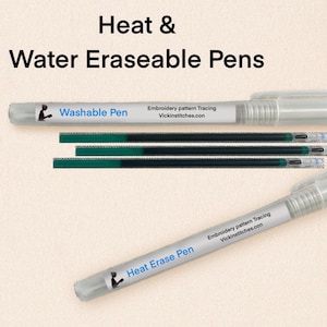 May include: Clear plastic pens labeled "Washable Pen" and "Heat Erase Pen" for embroidery pattern tracing. The image also shows several green and black pen refills. Text on the pens reads "Embroidery pattern Tracing Vickinstitches.com".