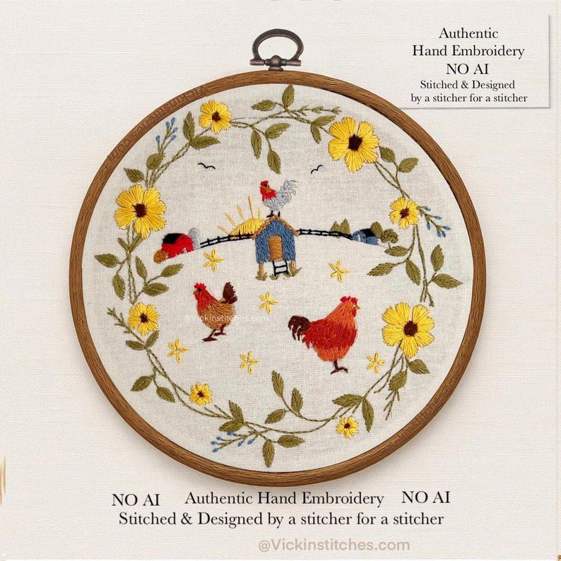 May include: A circular wooden embroidery hoop containing a white fabric panel with hand-stitched designs. The embroidery features a wreath of yellow sunflowers and green leaves surrounding two red chickens and a small blue coop with a rooster on top.