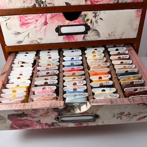 Beautiful wood embroidery floss organizer cabinet holds up to 300 bobbins full of floss