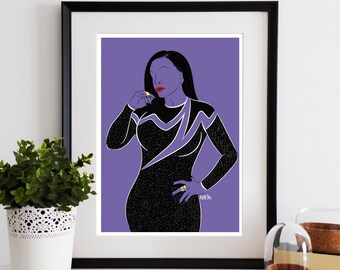 May include: Framed art print showing a stylized illustration of a person in a black dress with white detailing, red lipstick, and a gold ring. The background is purple. The artwork is displayed on a white shelf.