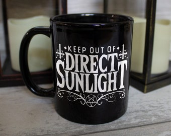 Keep Out Of Direct Sunlight Black Mug