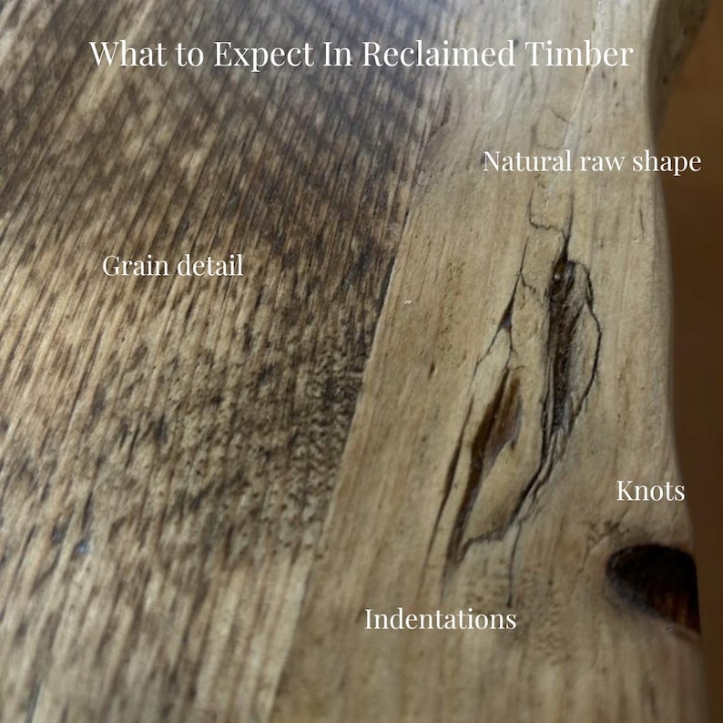 May include: A piece of reclaimed timber featuring a natural raw shape, visible grain detail, knots, and indentations. The text on the surface reads: What to Expect In Reclaimed Timber, Natural raw shape, Grain detail, Knots, and Indentations.