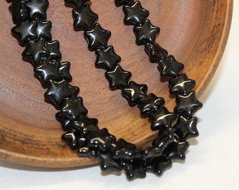 12mm Czech Pressed Glass Star Beads in Opaque Black , Sold by the 25 Pieces