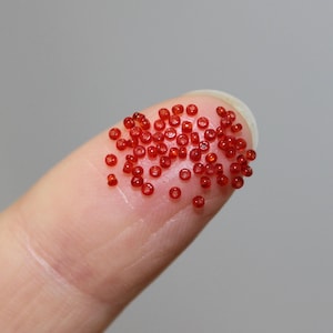 20/0 Transparent Ruby Red Vintage Micro Seed Beads, sold by the 5 grams