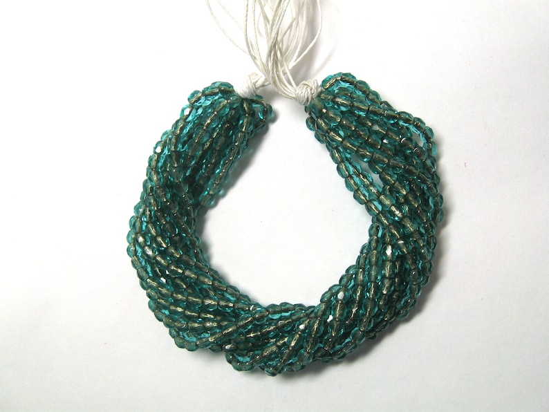 4mm Czech Fire Polish Beads Copper Lined Emerald Sold by the Half Mass
