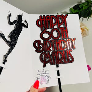 May include: Red and silver glitter cake topper with the text "Happy 60th Birthday Maris".