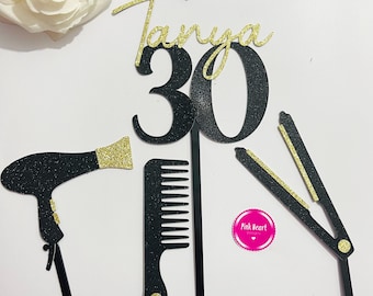 May include: Black and gold cake topper set featuring the name Tanya and the number 30. The set includes a hairdryer, comb, and straighteners.