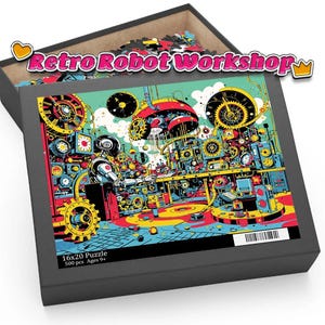 Op de afbeelding: Een puzzel van 500 stukjes in een zwarte doos. De puzzel toont een kleurrijke illustratie van een robotwerkplaats met tandwielen, machines en een robotfiguur. Op de doos staat "Retro Robot Workshop". Afmetingen: 40,6 x 50,8 cm.