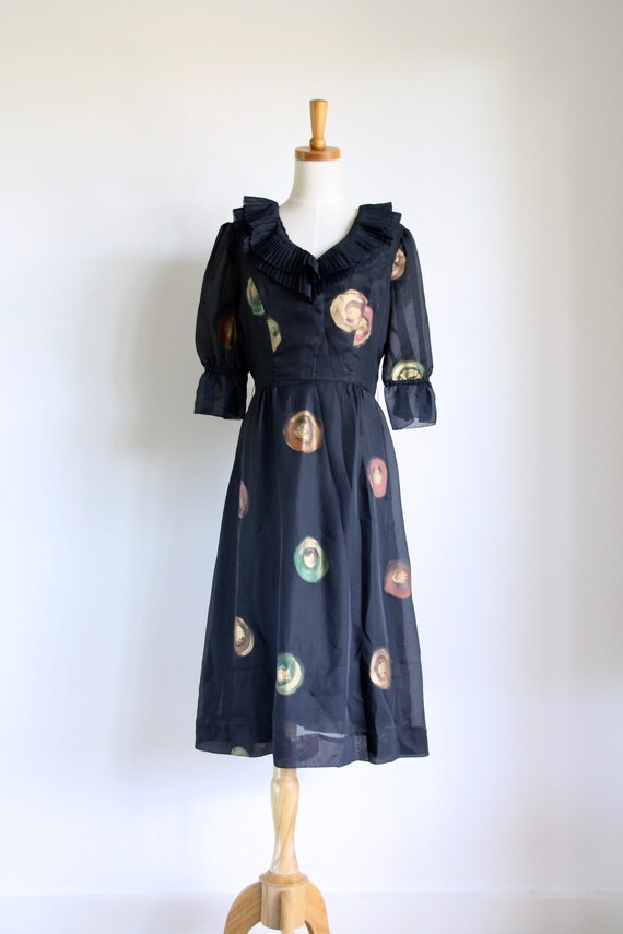 Black ruffle puff sleeve dress. 1980s chiffon gold