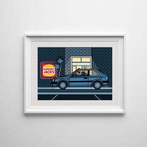 May include: A framed art print featuring a blue car parked in front of a brick building with a "Hungry Jacks" sign. The illustration has a retro, cartoon style with bold lines and colors, evoking a sense of nostalgia.
