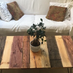 Reclaimed wood pallet coffee table with industrial hairpin legs in farmhouse and rustic style