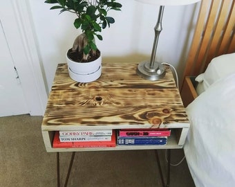 Reclaimed wood side table in rustic farmhouse style made with lightly charred pallet wood with urban industrial style copper hairpin legs
