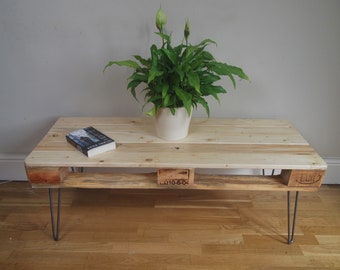 Upcycled pallet coffee table in rustic farmhouse style made with salvaged wood with industrial style hairpin legs