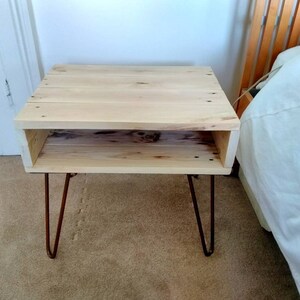 Reclaimed wood side table in rustic farmhouse style made with pallet wood with urban industrial style copper hairpin legs