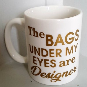 Fun gift &#39;The bags under my eyes are designer&#39; Great fun quote mug for a bestie