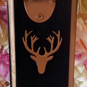 Outdoor/indoor bar bottle opener made from reclaimed Wood. Black with gold edge and gold  stag emblem