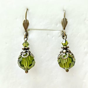 Crystal From Swarovski 10mm Faceted Olivine Antiqued Brass Lever Back Earrings. Olive Green dangle Earrings.
